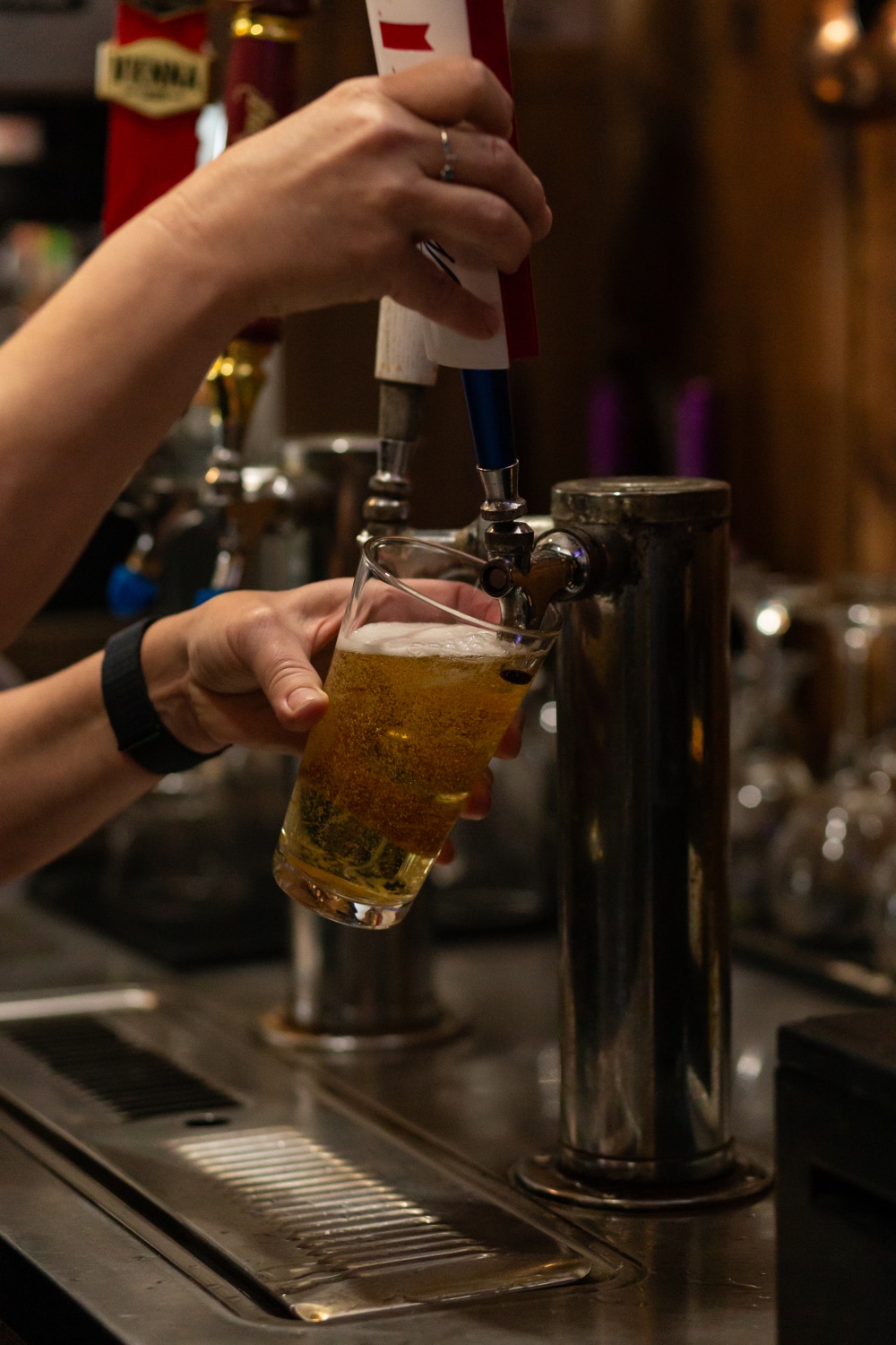 Beer being poured from a tap into a beer glass