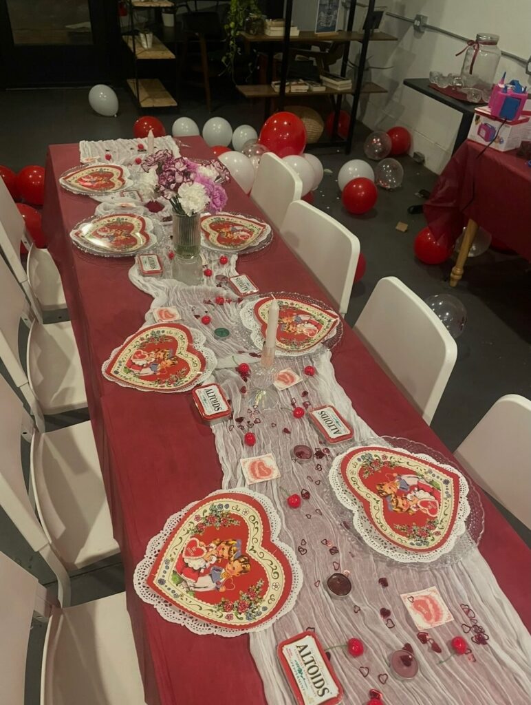 Long shot of table and chairs set for a Galentine's party