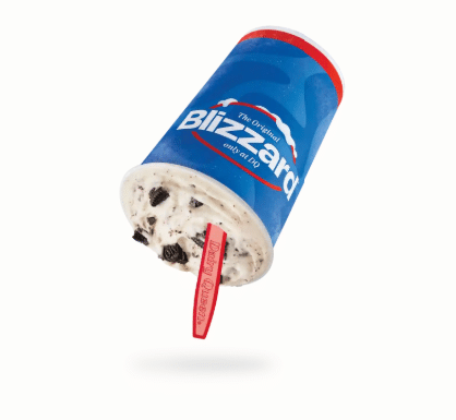 Mocha Brownie Mudslide Blizzed Treat picture in a blue cup upside down with red spoon sticking out of the frozen ice cream