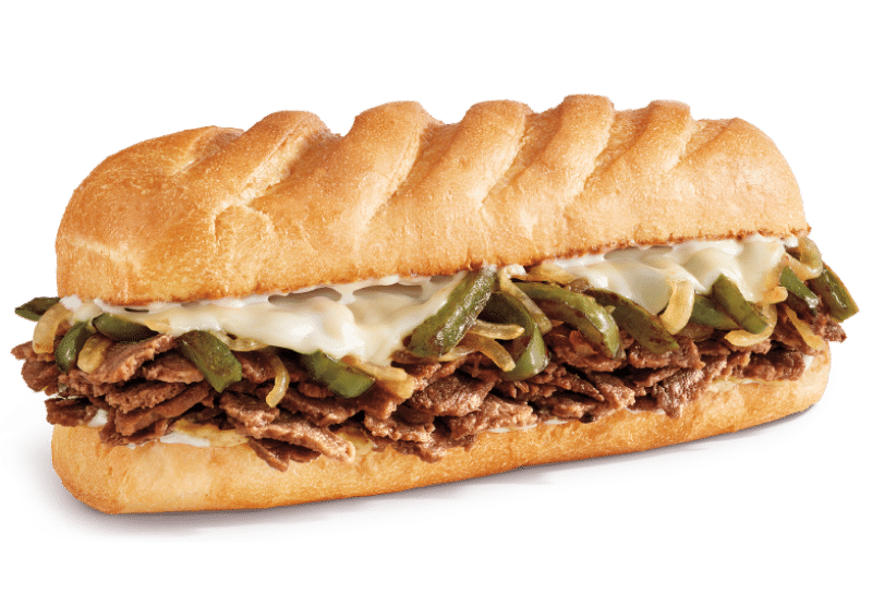 Firehouse steak and cheese sub sandwich with green pepper, onion, and melted provolone on a white roll
