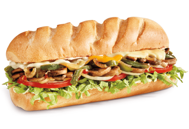 Vegie sub sandwhich on a white roll with caramelized green bell peppers and onions, mushroom, provolone, cheddar, monterey jack cheeses, lettuce tomato, onion, mayo, deli mustard, and italian dressing