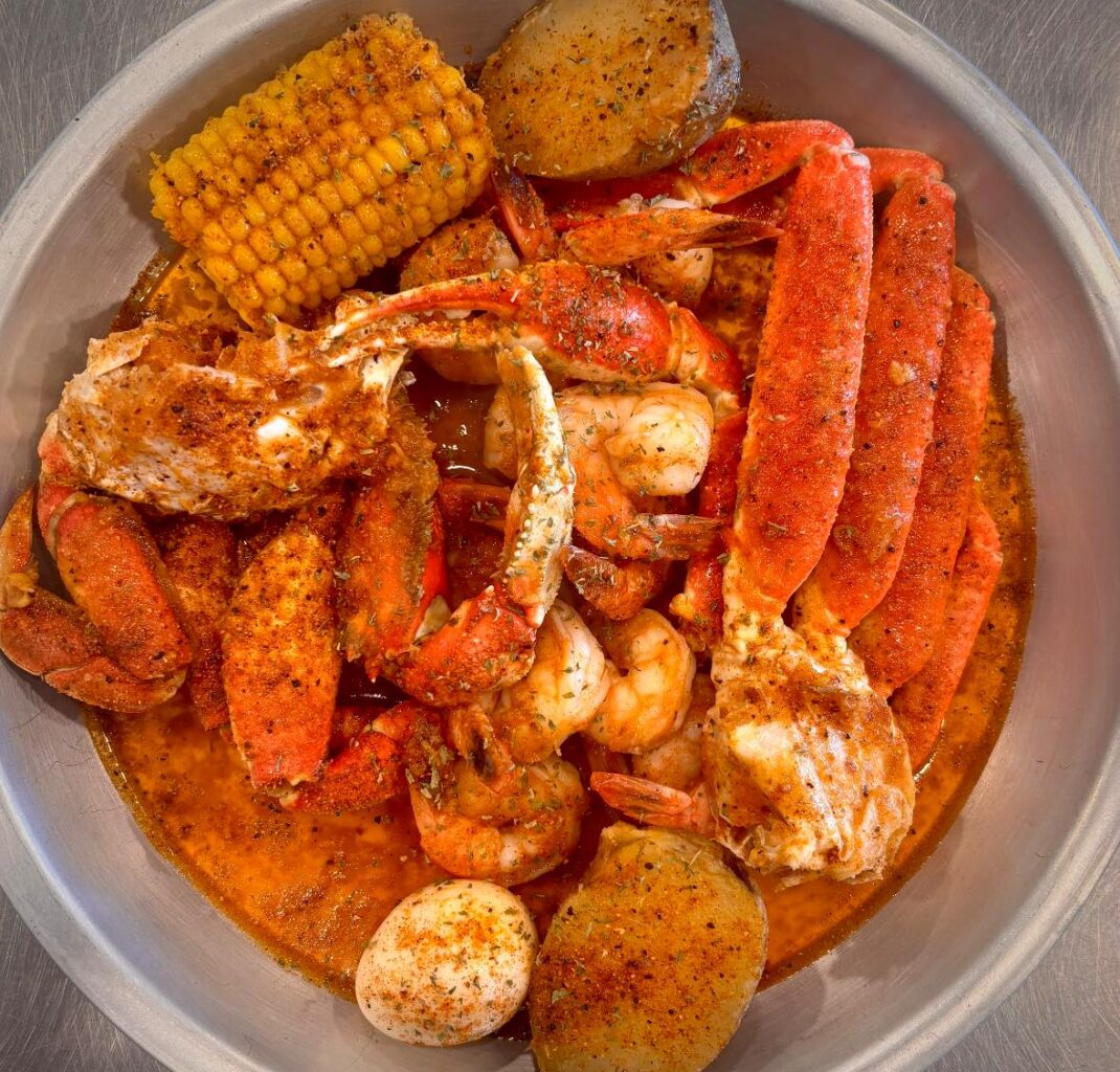 Bowl of Low Country Boil with Crab Leg Shrimp Potato Corn on the cob