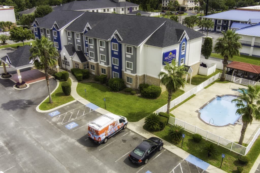 Aerial view of Microtel Inn & Suites by Wyndham Kingsland and its outdoor pool area