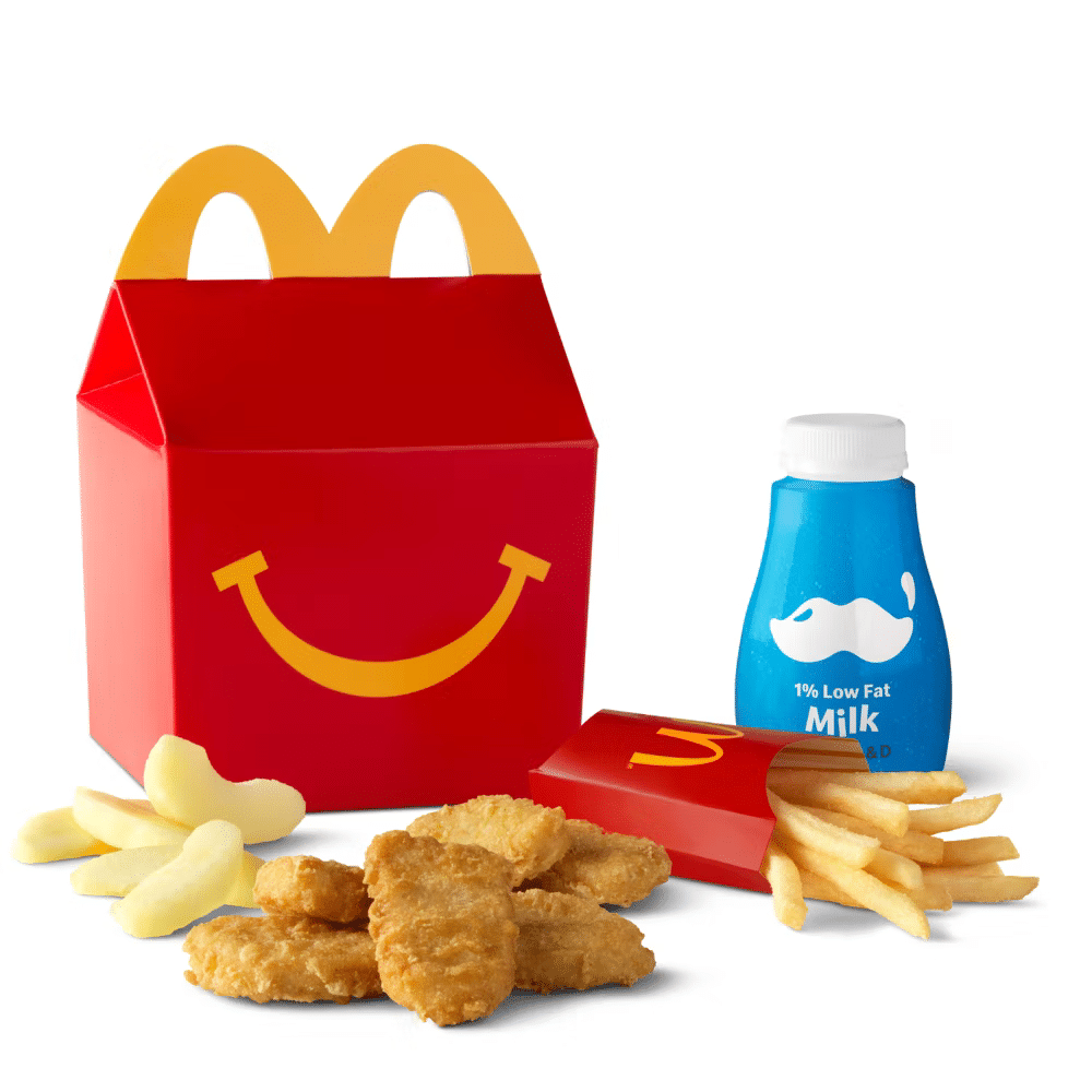 McDonald's 6-piece chicken McNugget Happy Meal with branded box, apple wedges, French fries, and a bottle of milk