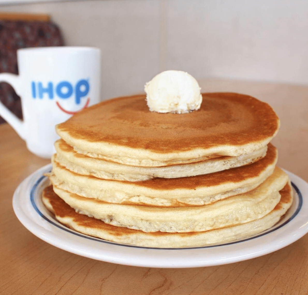 A tall stack of buttered pancakes at IHOP in Kingsland GA