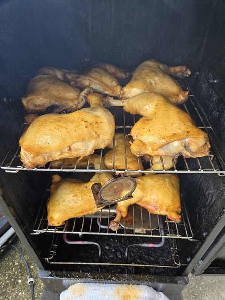 Mesquite smoker with 8 to 10 chicken quarters, almost cooked