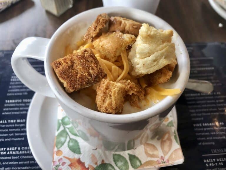 Warm potato soup with dried bread and cheese topping menu item at Creative Catering & Design