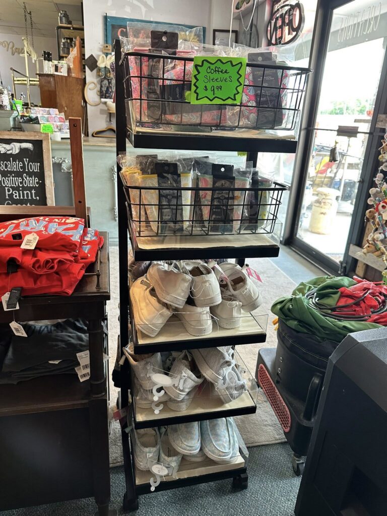 Wire shelf display of eyeglass cases and sneakers that can be decorated
