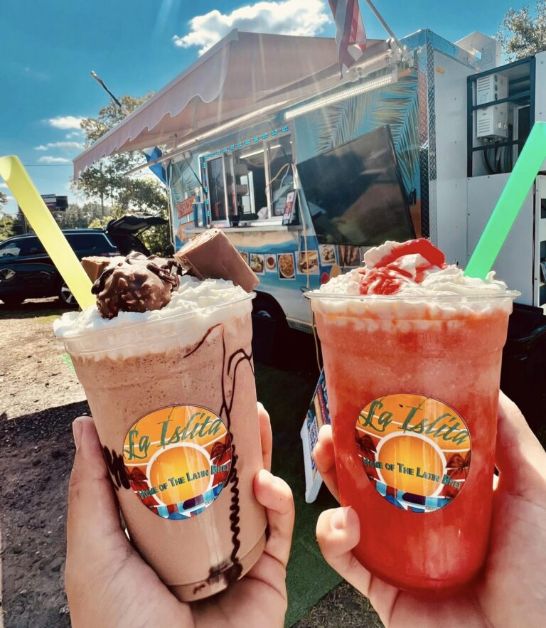 Two frozen specialty drinks--Nutella Frappe and Pina Colada--in clear branded cups from La Islita food truck
