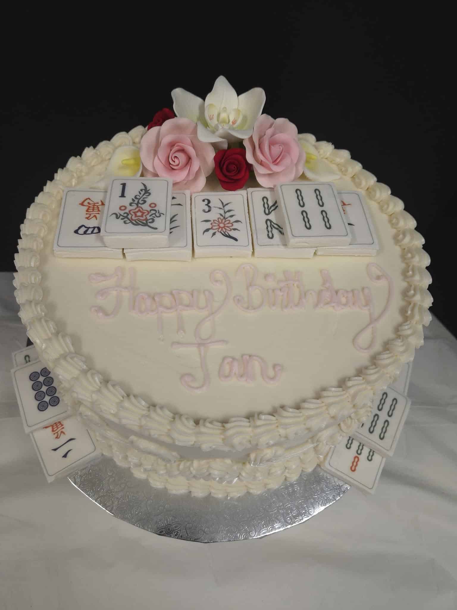 Round birthday caked decorated with mah jong theme