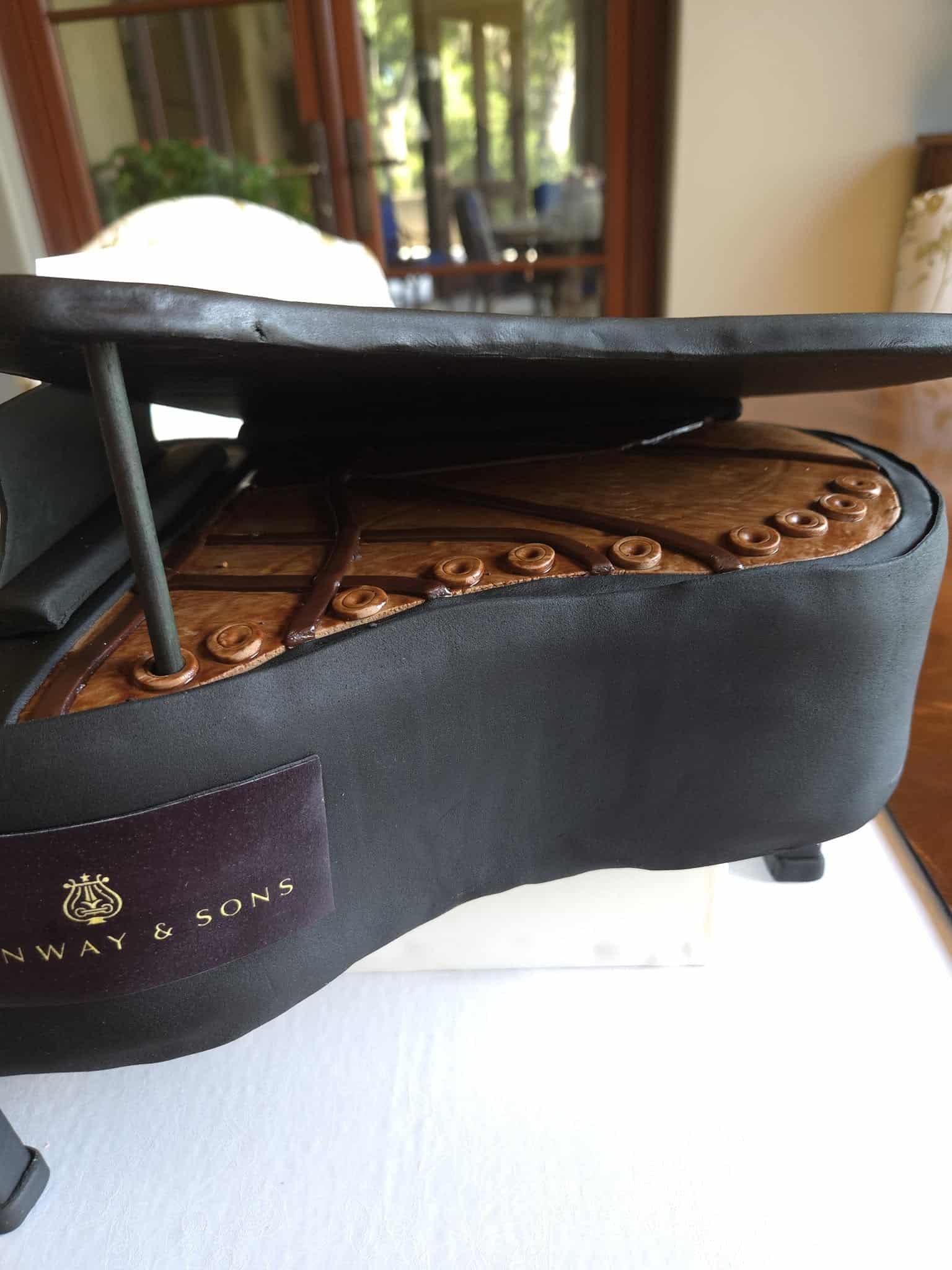 Detail of cake created as a Steinway grand piano