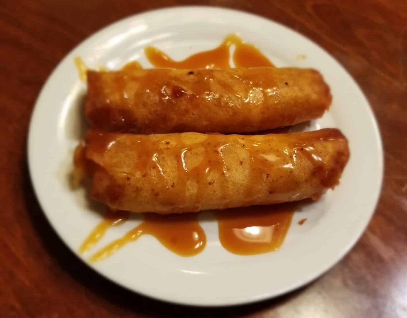 Hot apple pie rolls with caramel sauce from Serendipity Bakery