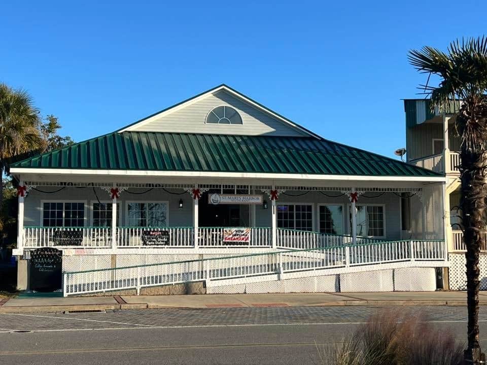 Exterior Daytime photo of St. Marys Harbor Restaurant with ramp and railed porch