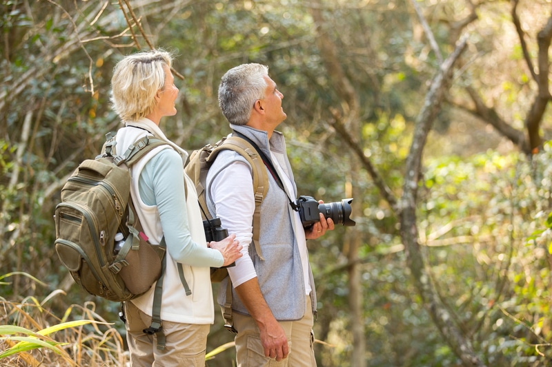 An older couple wait in the woods birdwatching in Kingsland Georgia