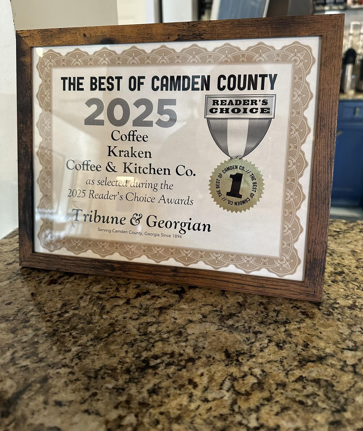 A framed certificate for Kraken Coffee named Readers' Choice Best of Camden County 2025