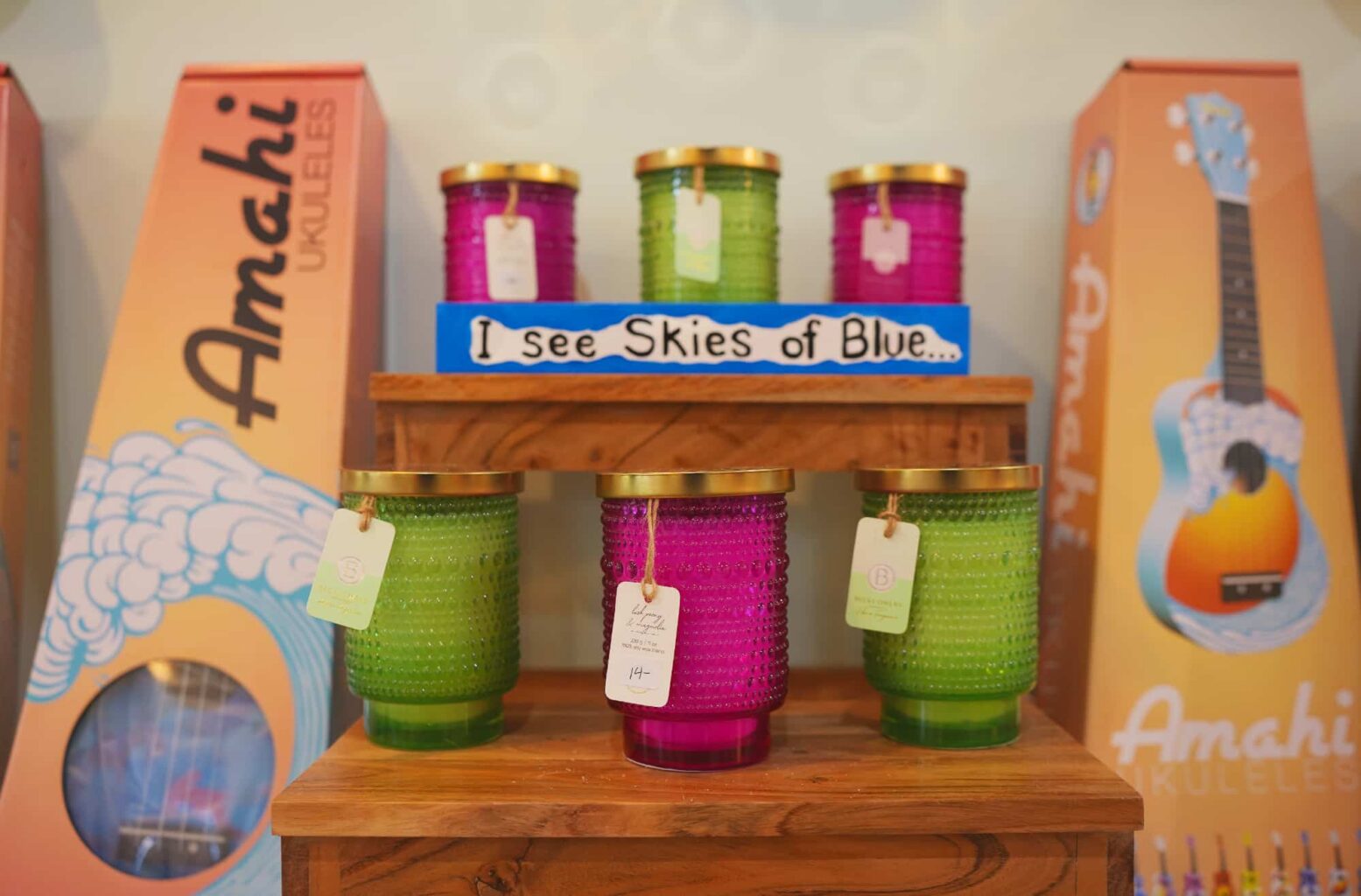 Display of Pink and Green Candles & Ukuleles