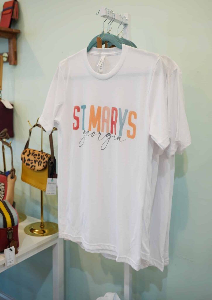 White T-shirt printed with St. Marys, Georgia" in coloful lettering (from Facebook