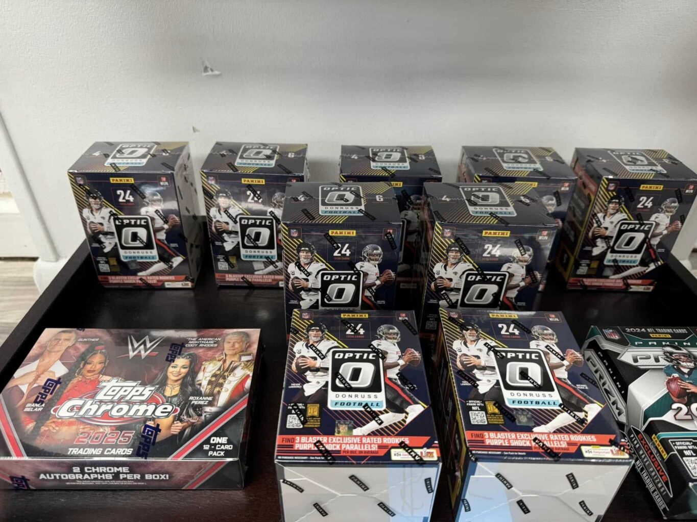 Boxes of American Football Collector Cards displayed on a table.