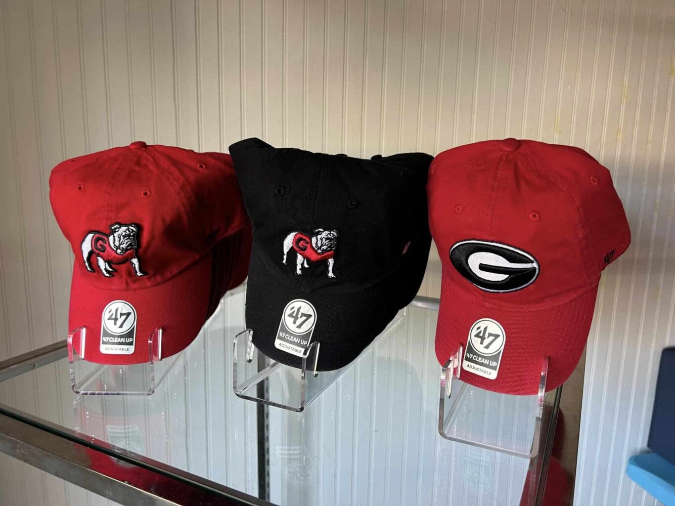Display of baseball caps for the University of Georgia Bulldogs