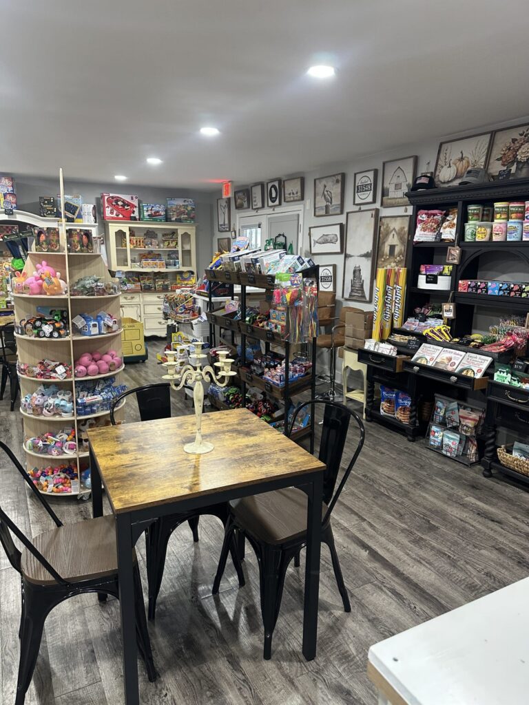 Interior showing gift merchandise and seating at a table for two