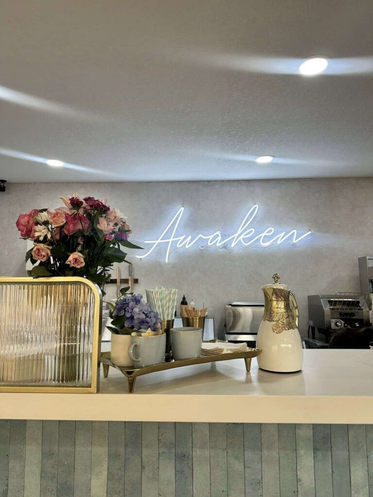Awaken Coffee counter with flowers and coffee tray