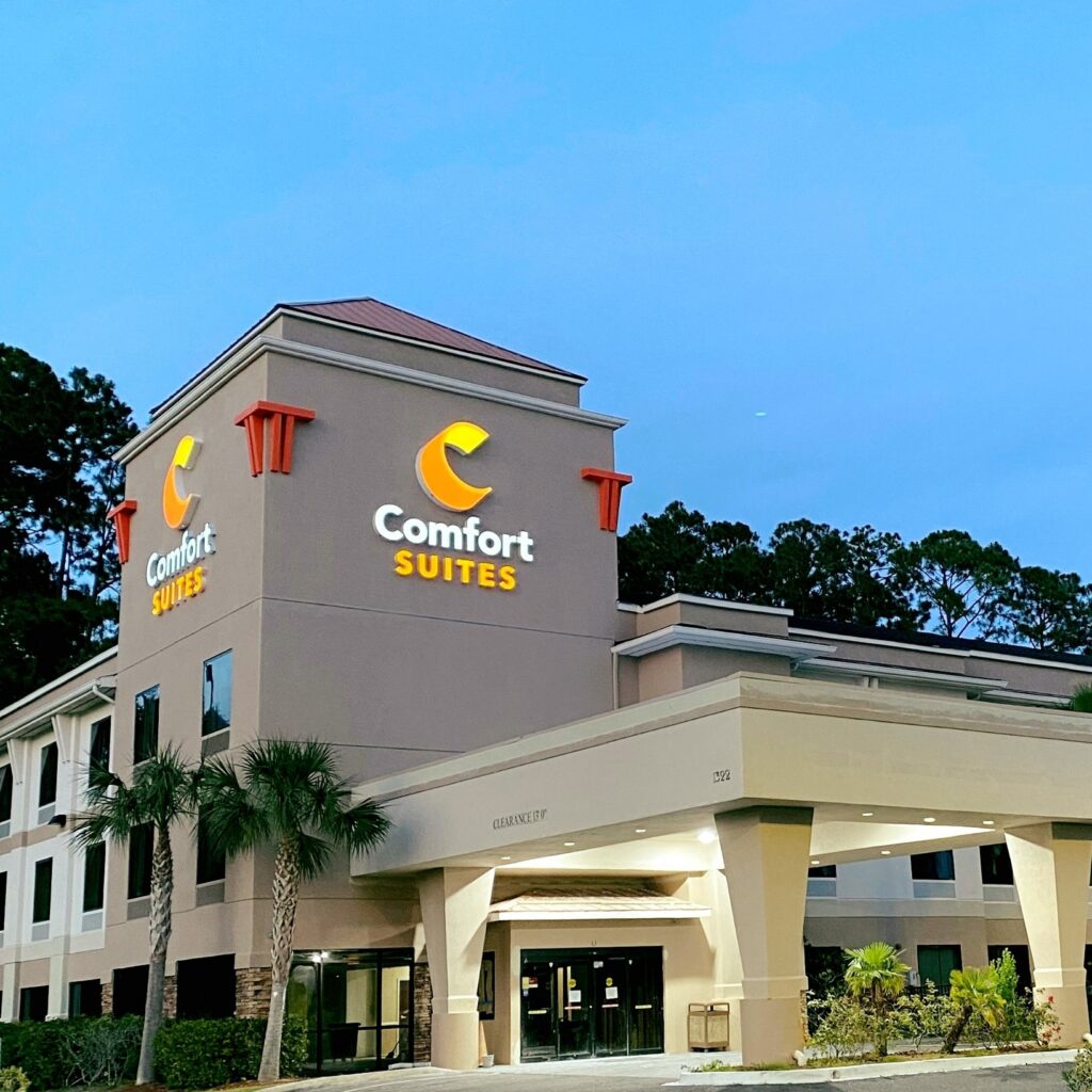Comfort Suites Exterior Evening shot of Building showing road sign, driveway, portico