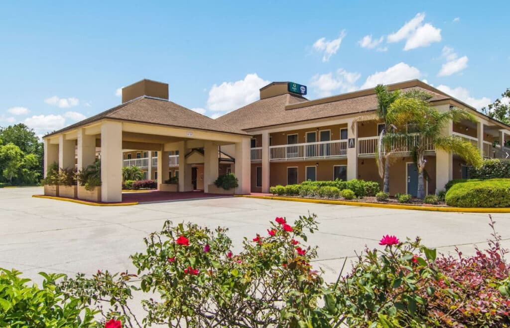 Suburban Extended Stay Hotel Exterior portico and front entrance shot from driveway