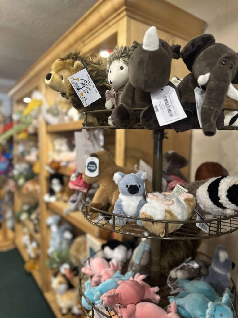 Plushies display on tiered black wire rotating rack