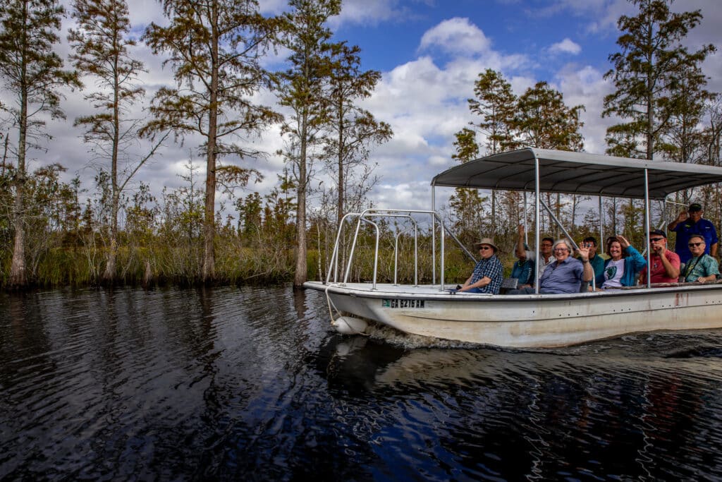 people-on-a-guided-boat-tour-of-the-okefenokee-swamp-in-folkston-georgia