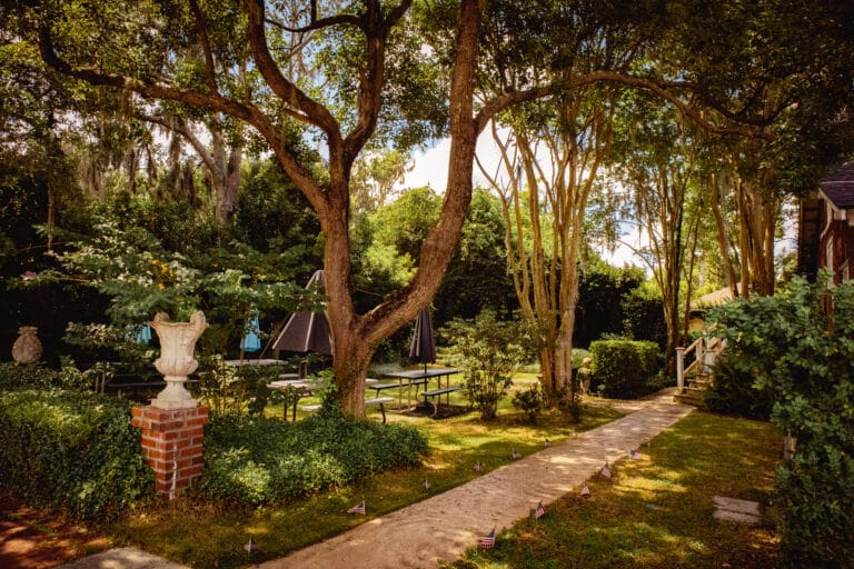 Downtown Kingsland park with shaded brick walkway and lots of trees