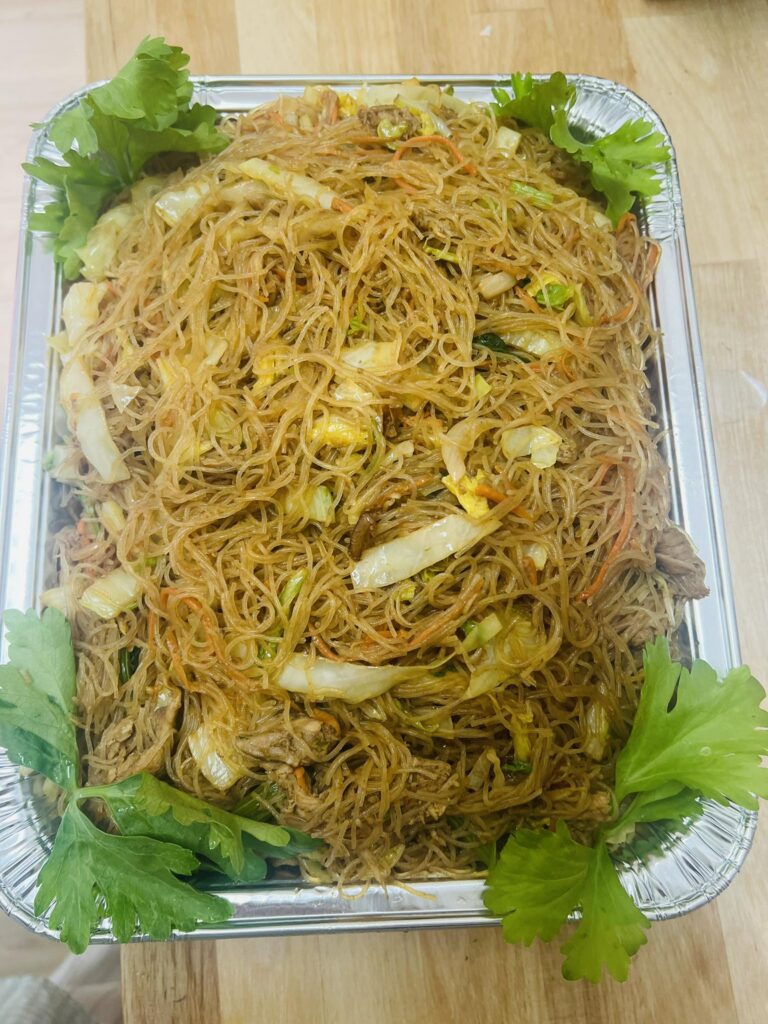 Aluminum pan of chicken pancit