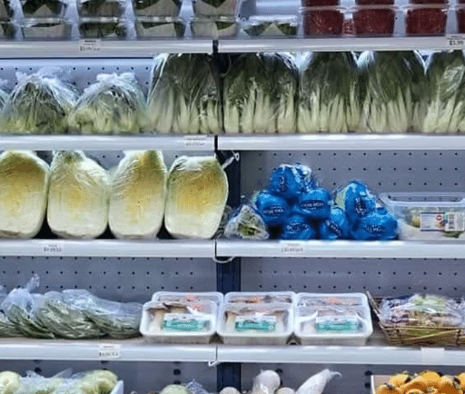 Cold produce section with leeks and cabbages