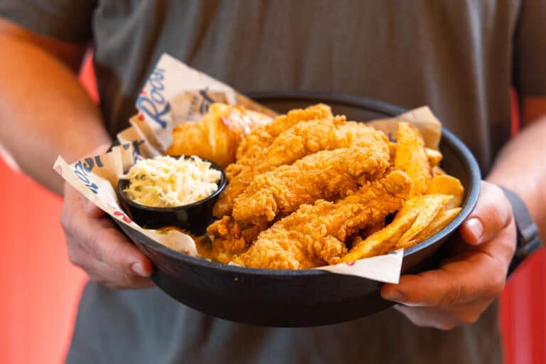 Southern Roost fried chicken tenders with golden fries and coleslaw