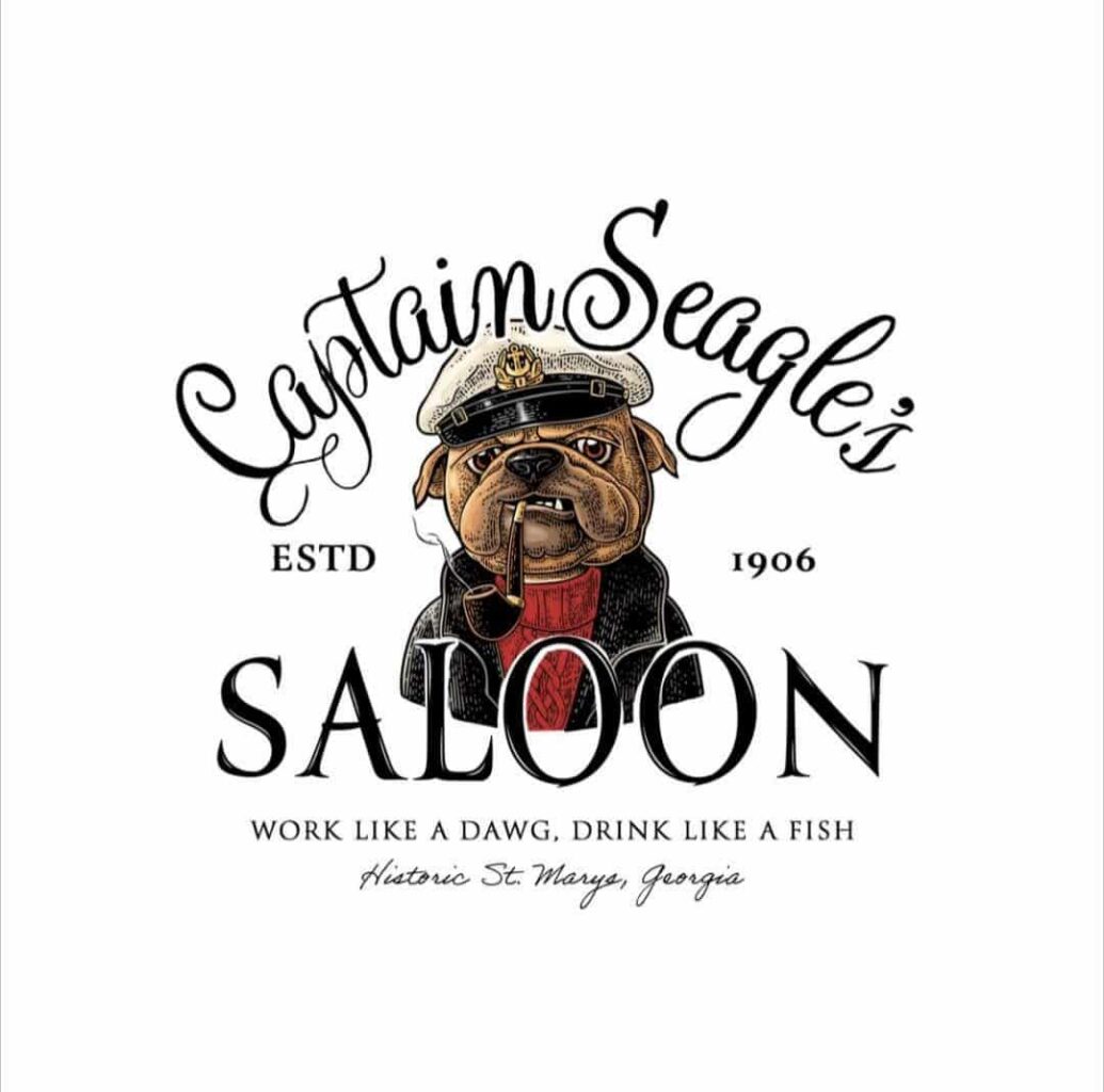 Captain Seagle's Saloon Logo which is a Georgia bulldog dresses as a fisherman with a pipe and a hat. The slogan, "Work like a dawg, drink like a fish," then "Historic St. Marys, Georgia" at the bottom and flanked by "Est. 1926"
