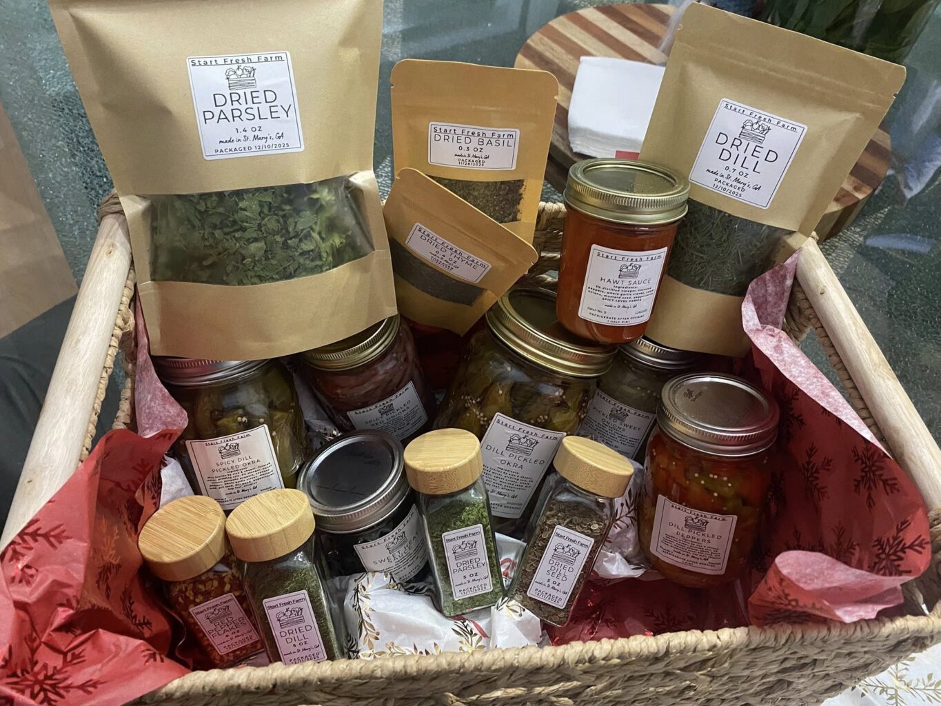 basket of packaged herb and jarred sauces from Start Fresh Farm