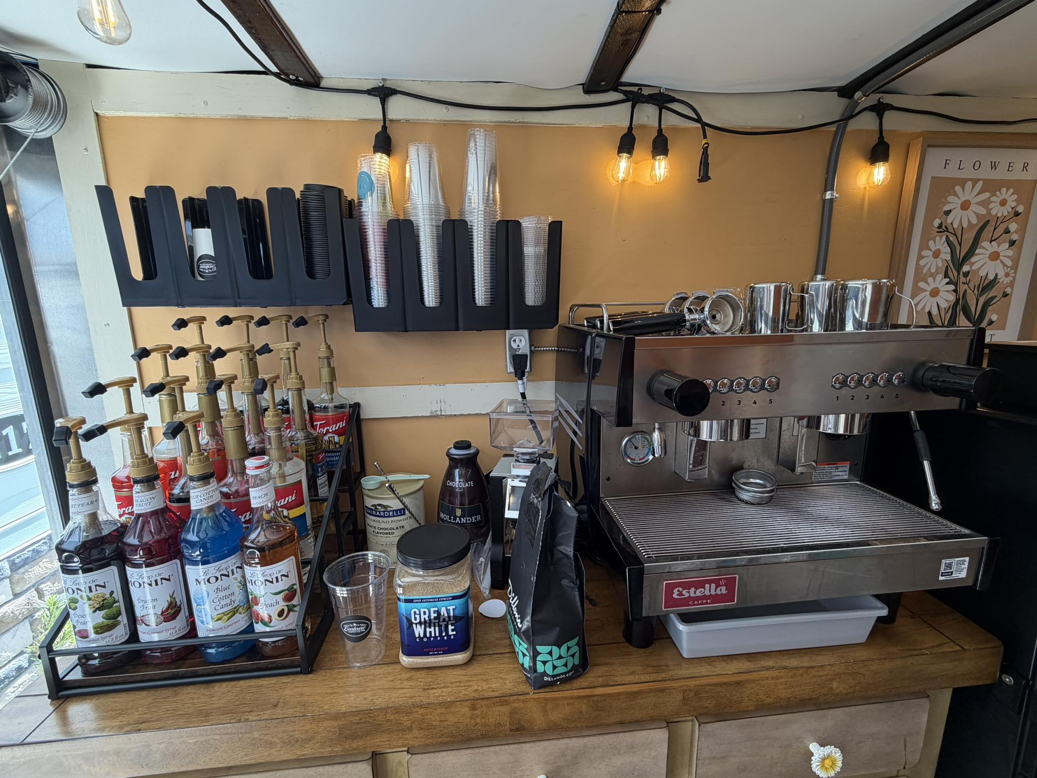 Interior of coffee truck prep counter with flavored syrup bottles