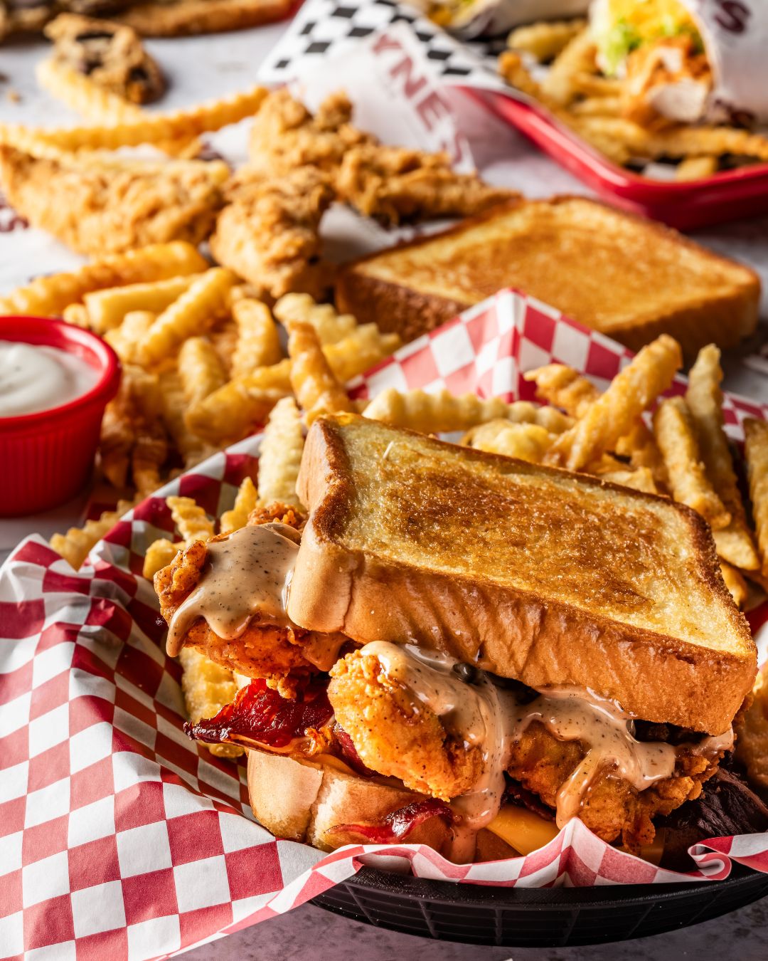 Layne's Chicken Finger sandwich meal on Texas and crinkle-cut fries