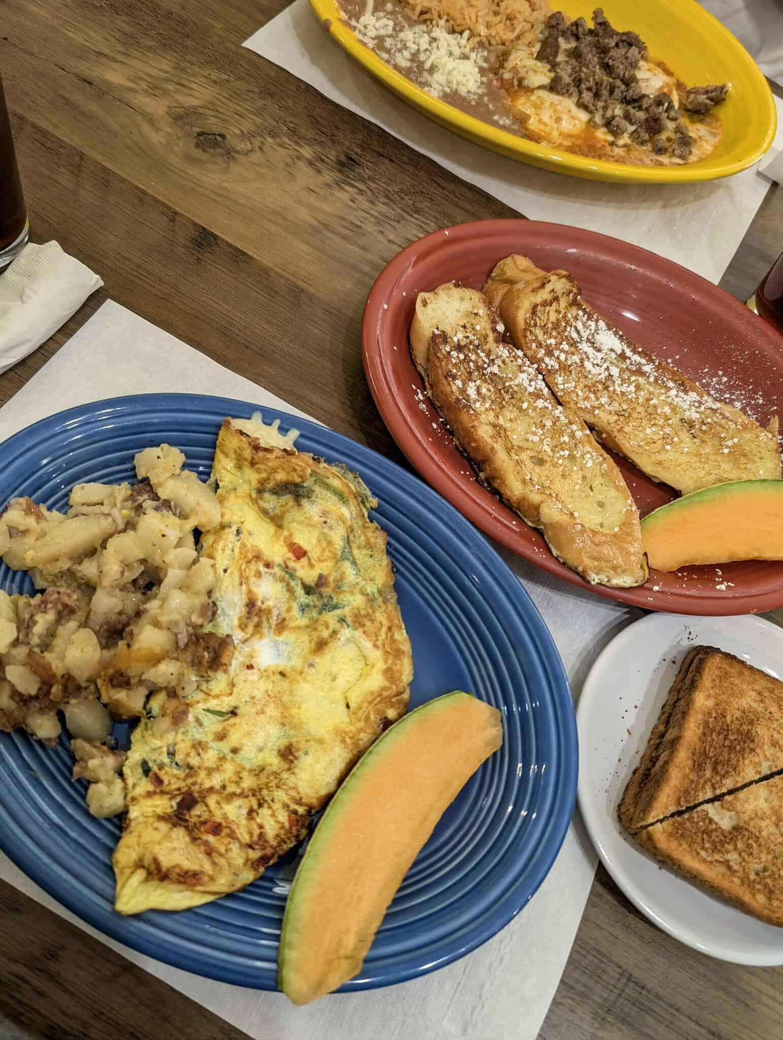 Breakfast with omelettes, fresh fruit, French Toast and Huevos Rancheros at Buenos Dias