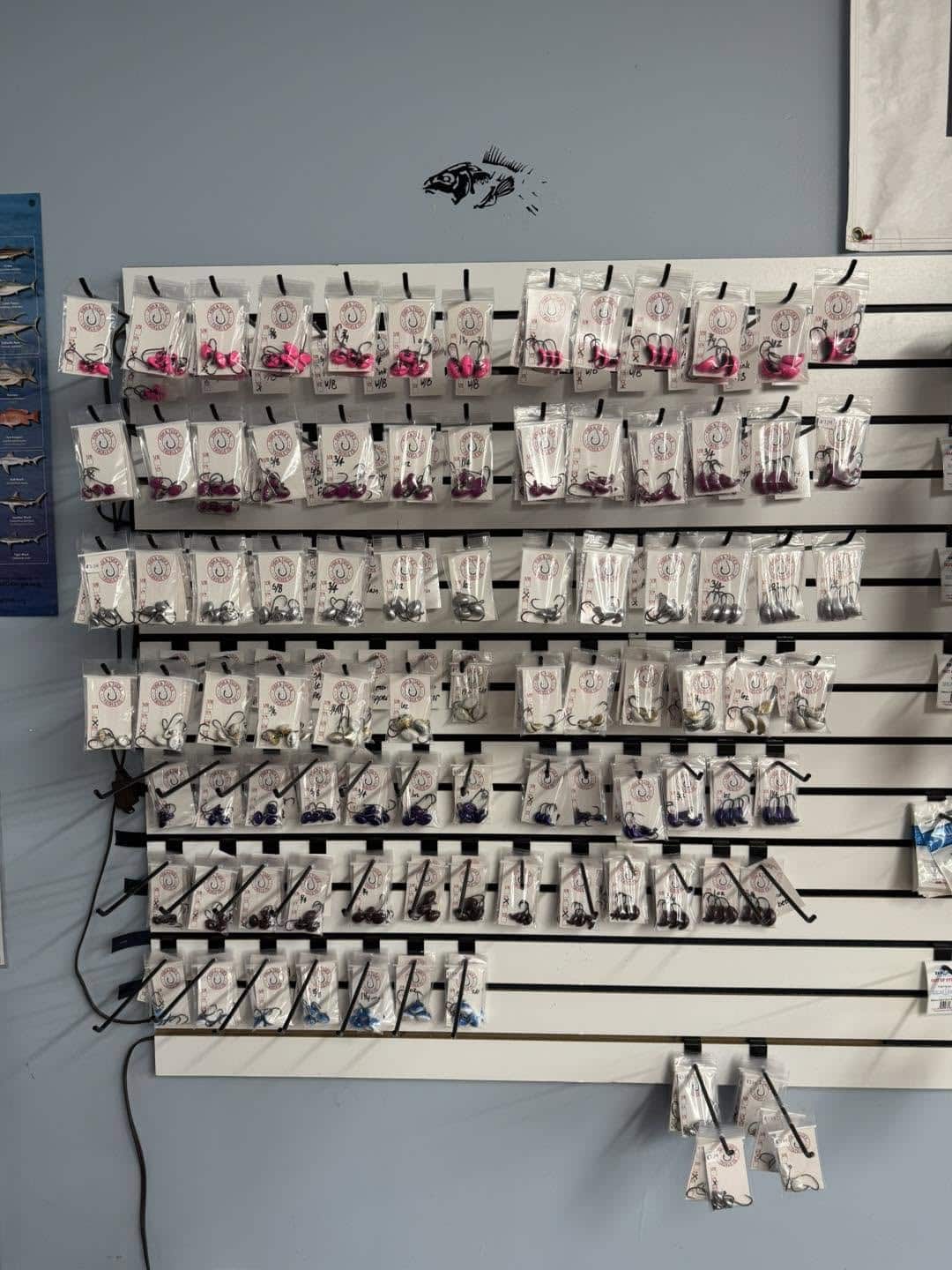Wall display of fishing tackle jigs