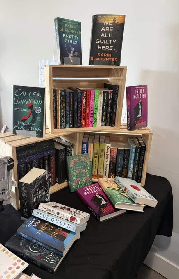 Bookseller book display of novels in and on wooden crates