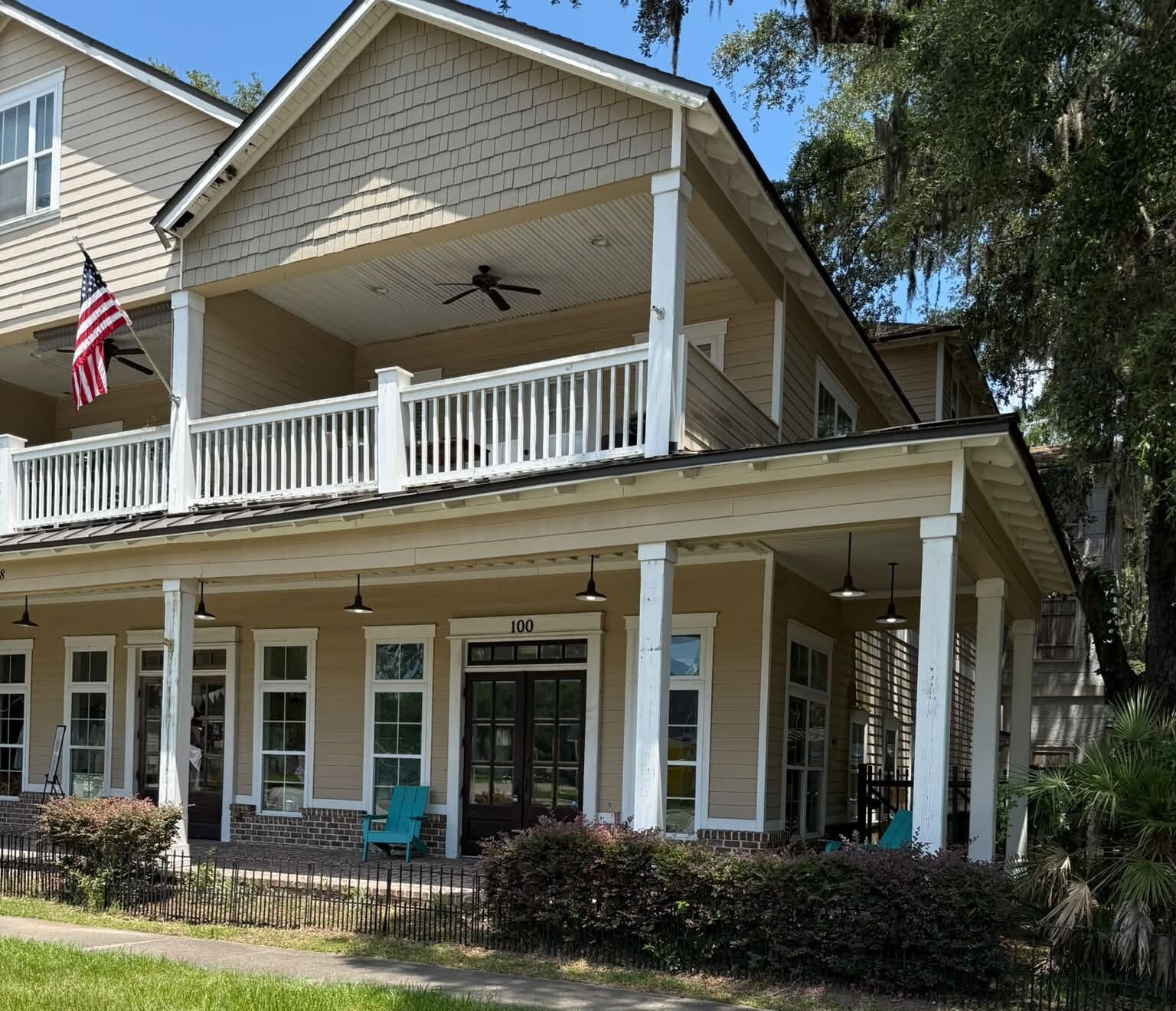 Store front in old wood building with wrap around porch