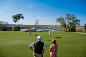 Two older couples on a golf course in coastal Georgia