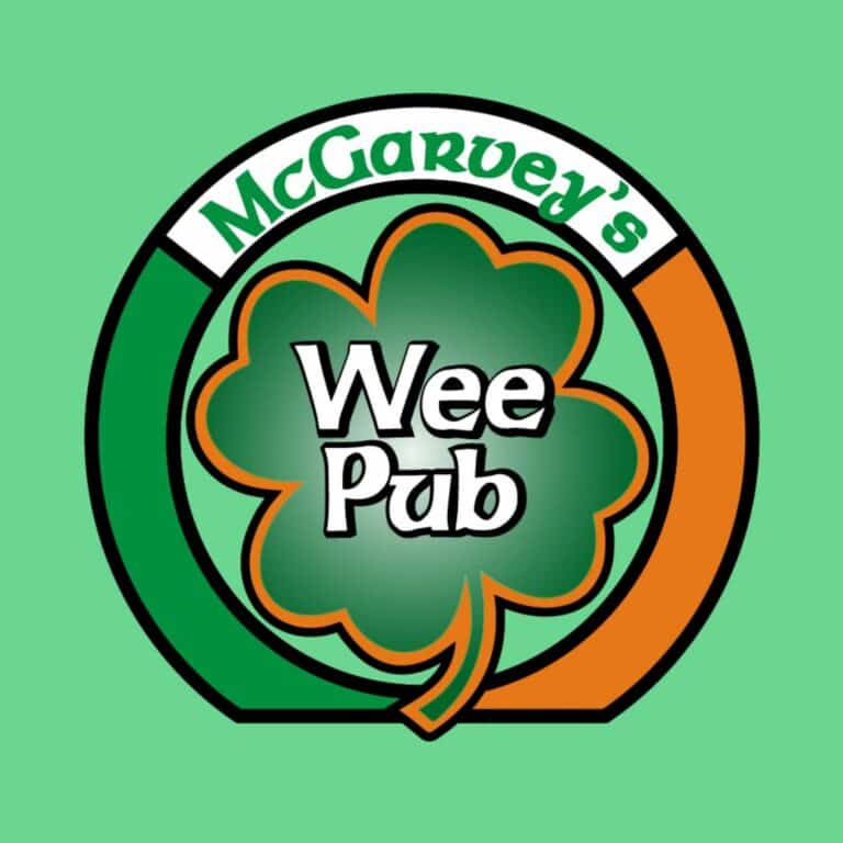 Green, orange, and white circle with shamrock--logo for mcGarvey's Wee Pub South in St. Marys, Georgia